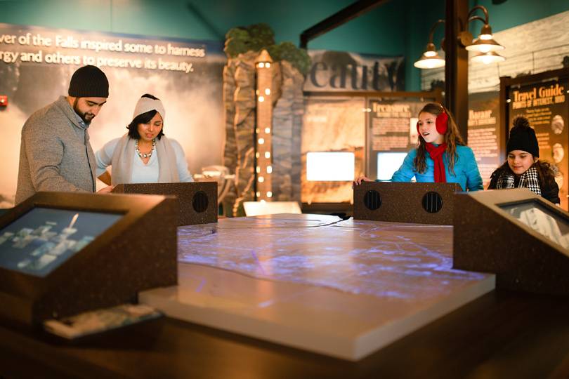 Guests exploring a museum display at Niagara Falls state park