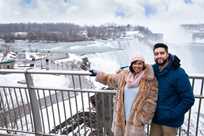 Two Niagara Falls visitors at the top of the falls