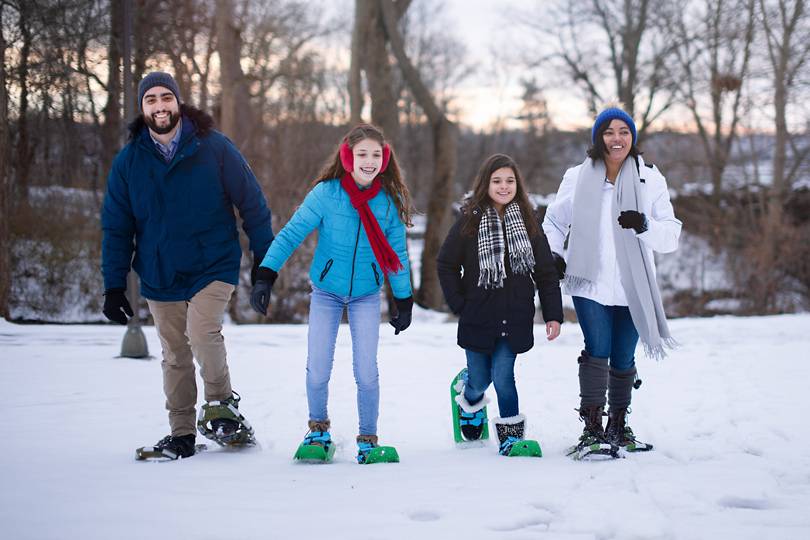 A family snowshoeing in Niagara Falls State Park in winter