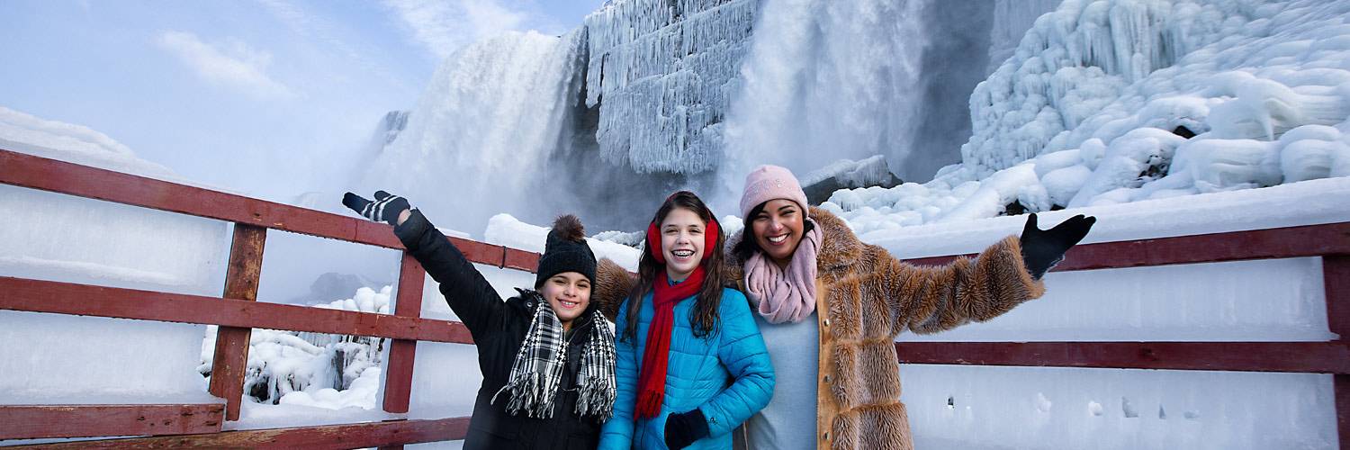 A family taking in the sights at Niagara Falls in winter