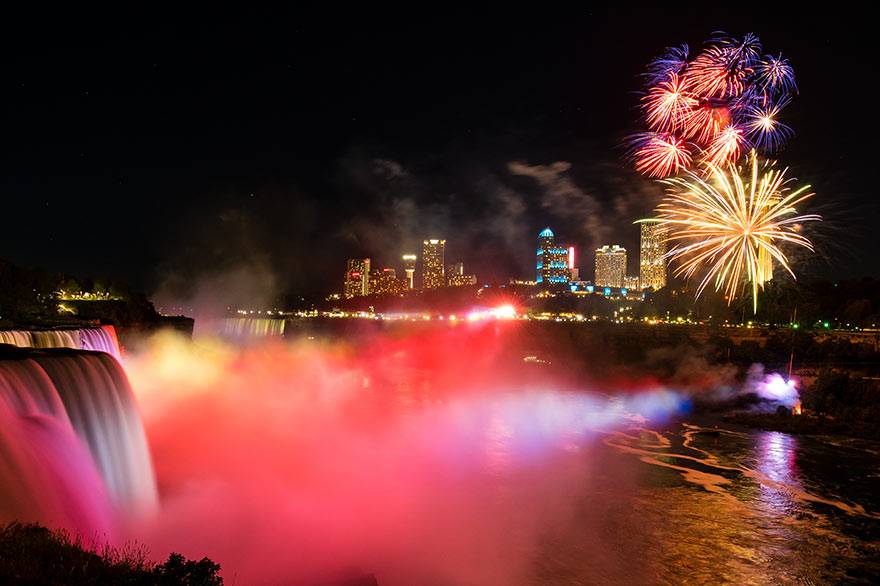 Fireworks light up the sky over Niagara Falls at night