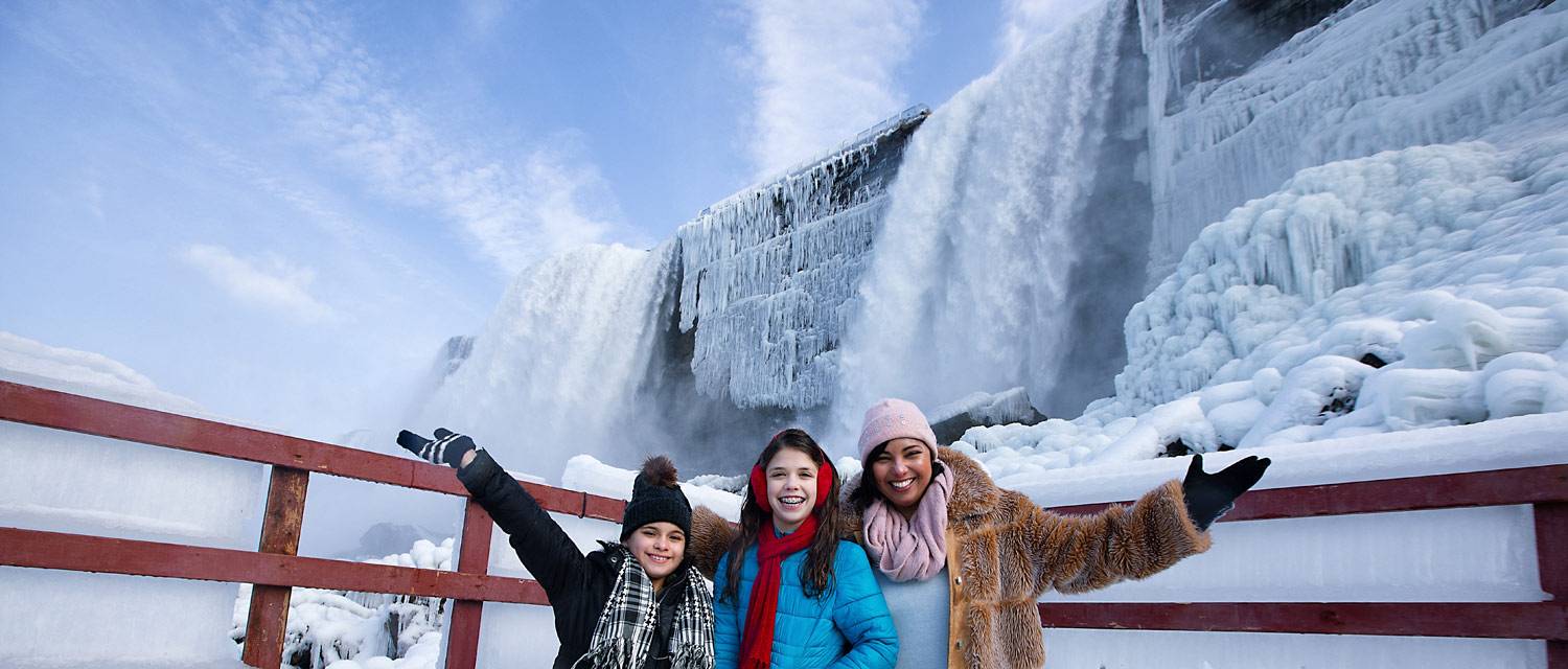 A family exploring Niagara Falls in winter